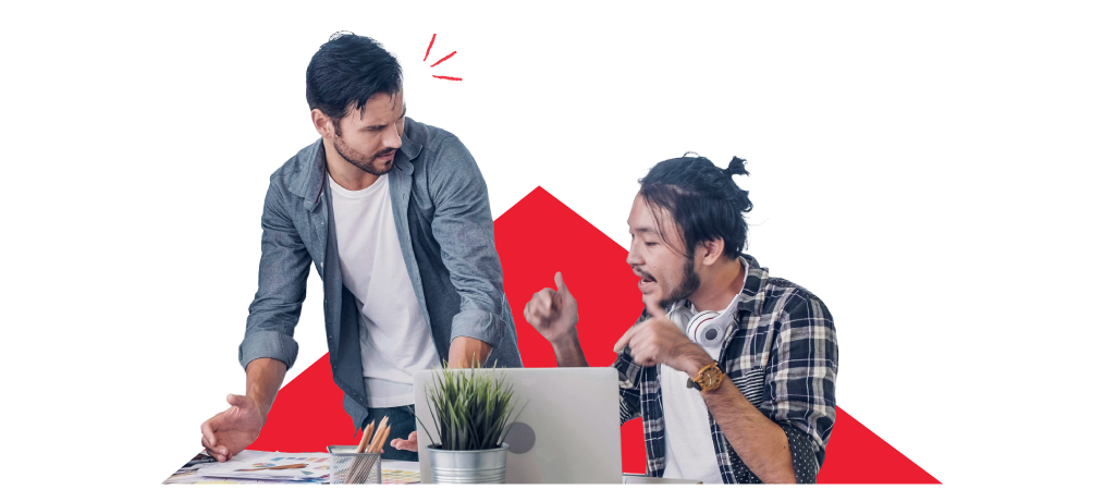 Two colleagues working over a desk looking tense as if navigating conflict.
